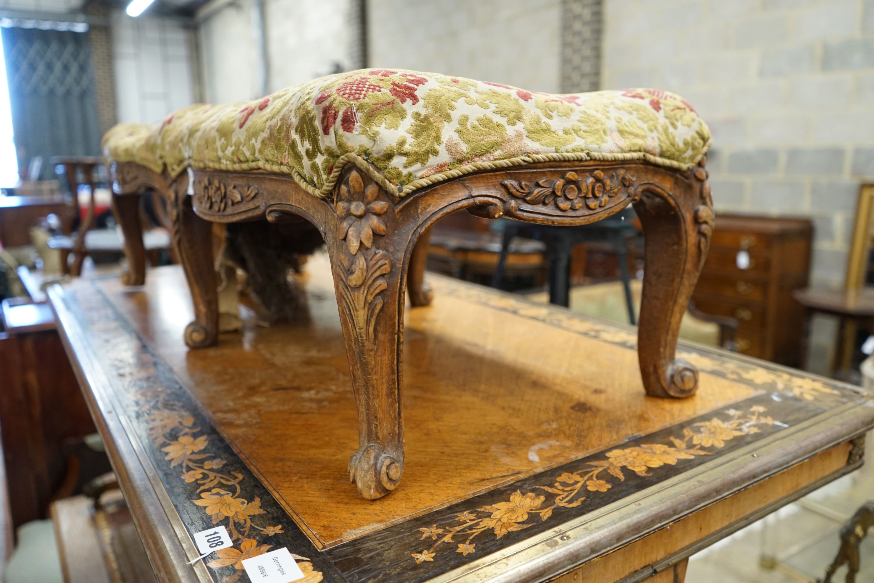 A Victorian walnut fender stool requiring re-upholstery, length 108cm, depth 40cm, height 33cm